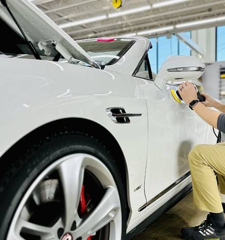 Applying ceramic coating to the side of a car