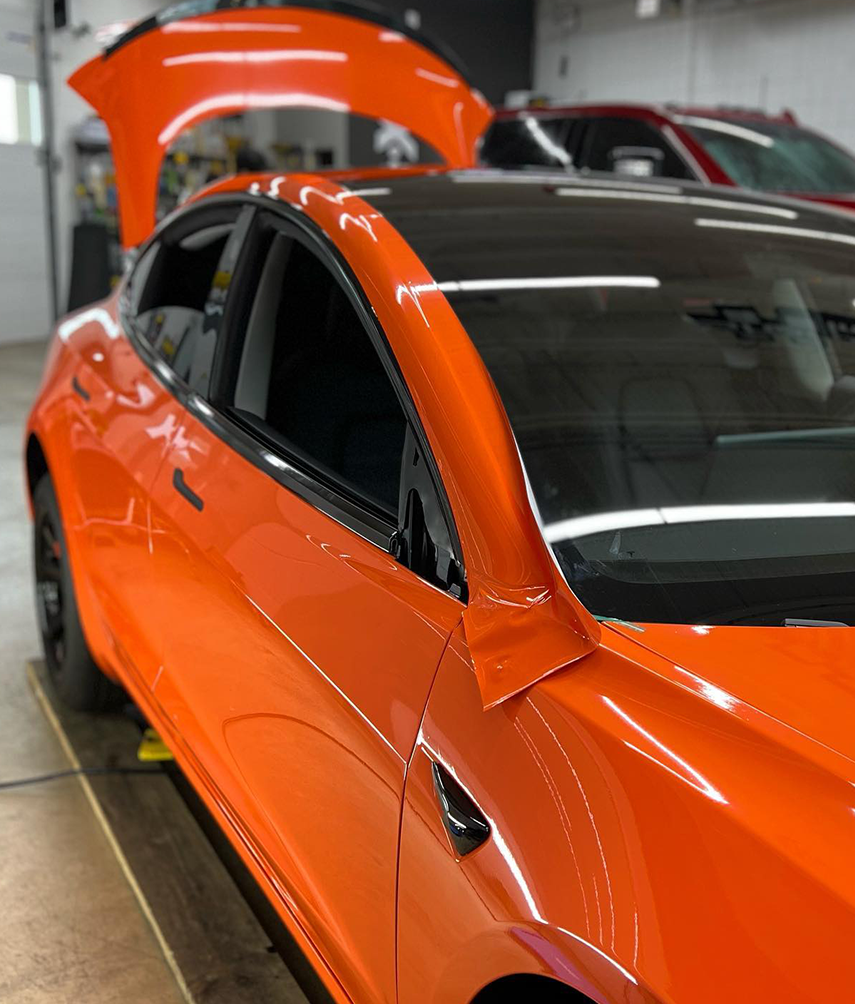 Installing an orange vehicle wrap